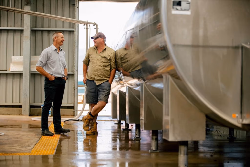 LIC consulting chatting to a dairy farmer